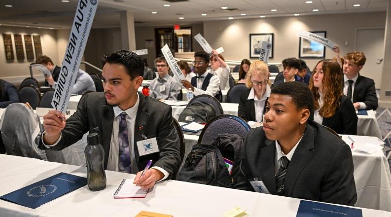 Students sitting at tables.